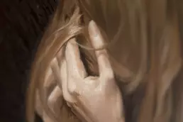 Detail of the assemblage “Magic of the Center” by Frank Rosenzweig: Close-up of the hand, hair, and facial features of a female nude in an oil painting.